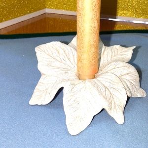 A white glittered poinsettia candle holder